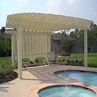 scallop=style pergola patio cover over spa w/ decorative shade wall.